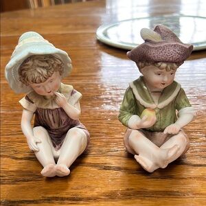 Vintage 1960’s era Piano Babies.  Boy and girl.  Boy has repair on neck.